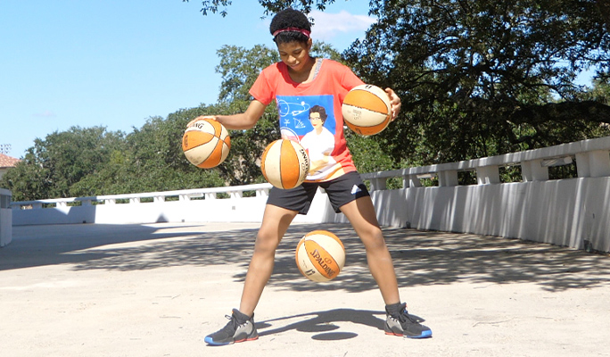 zaila bouncing four basketballs