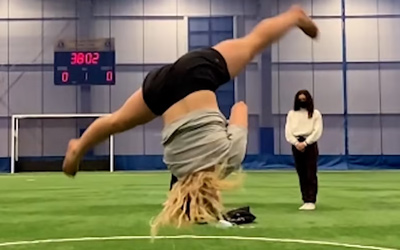 girl doing cartwheel with no hands