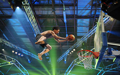 man dunking from a trampoline