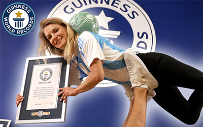 Woman footballer with certificate