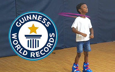 Kid breaks HULA HOOP world record