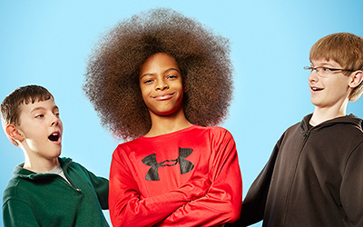 boy with largest afro and two boys next to him looking shocked
