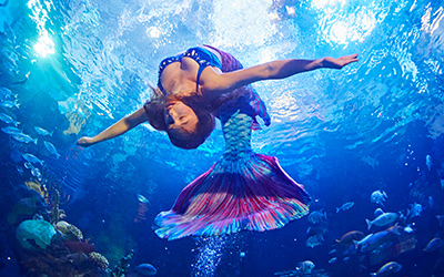 mermaid doing tricks underwater