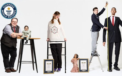tallest and shortest people being measured