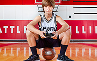 tristen geren sitting on top of basketball