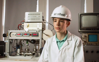 young boy in lab gear